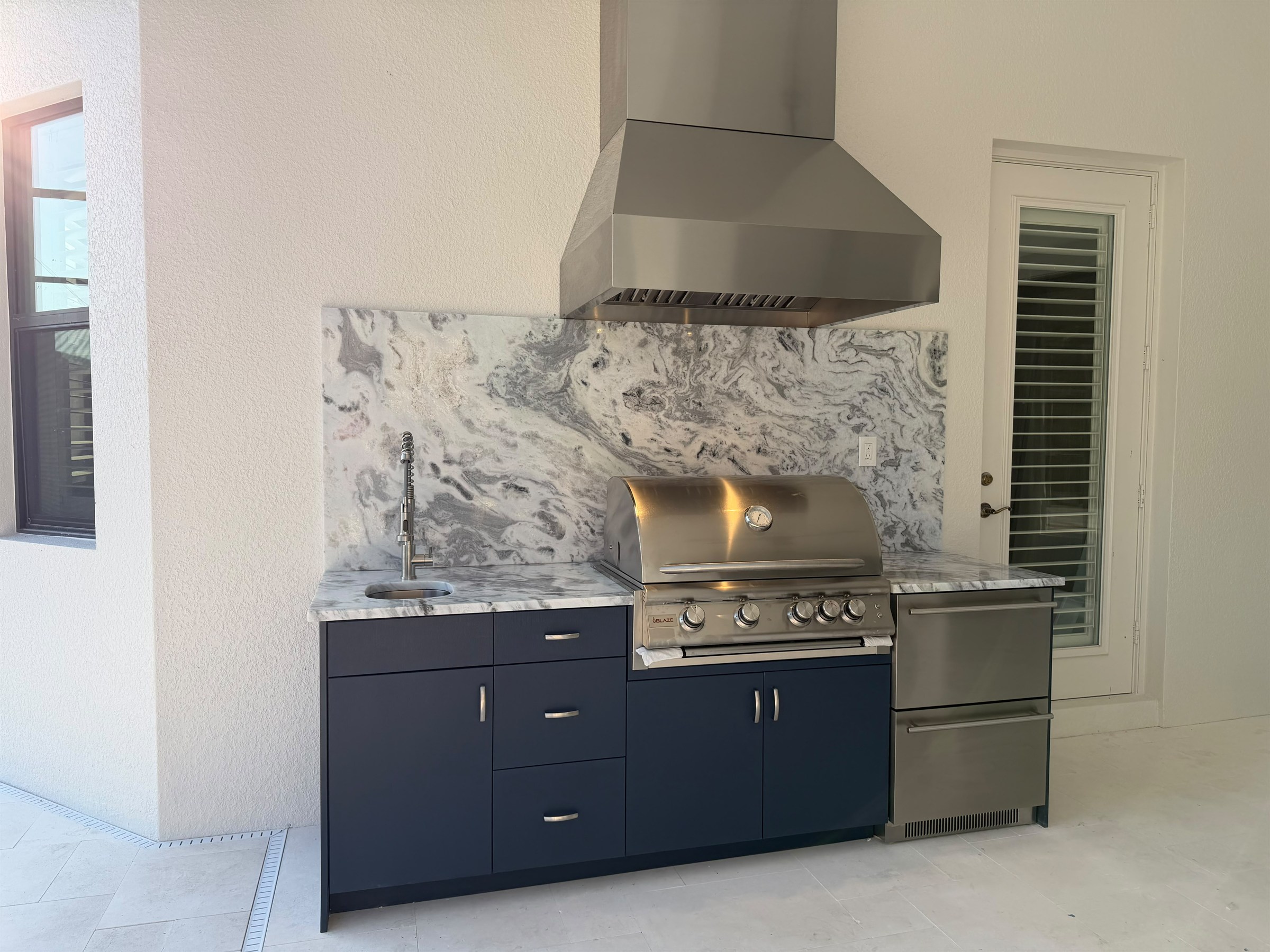Indigo Blue outdoor kitchen with Flat Panel door style by Bespoke Cabinets and Doors
